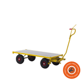 Carrello Ravendo TW 1500 LOW in acciaio giallo con piano in legno, ruote solide e profilo ribassato, ideale per trasporti industriali fino a 1200 kg.
